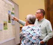 Stacey Gunter and Hanne Hansen discuss a poster at GLNC